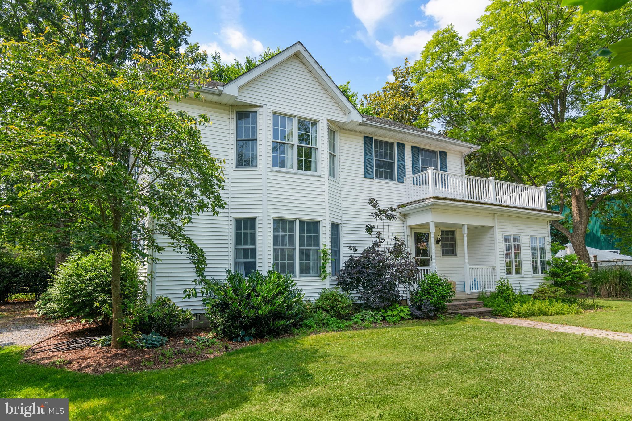101 Sinclair Street Oxford, MD 21654 - Photo 2 of 31 a front view of a house with a yard and trees