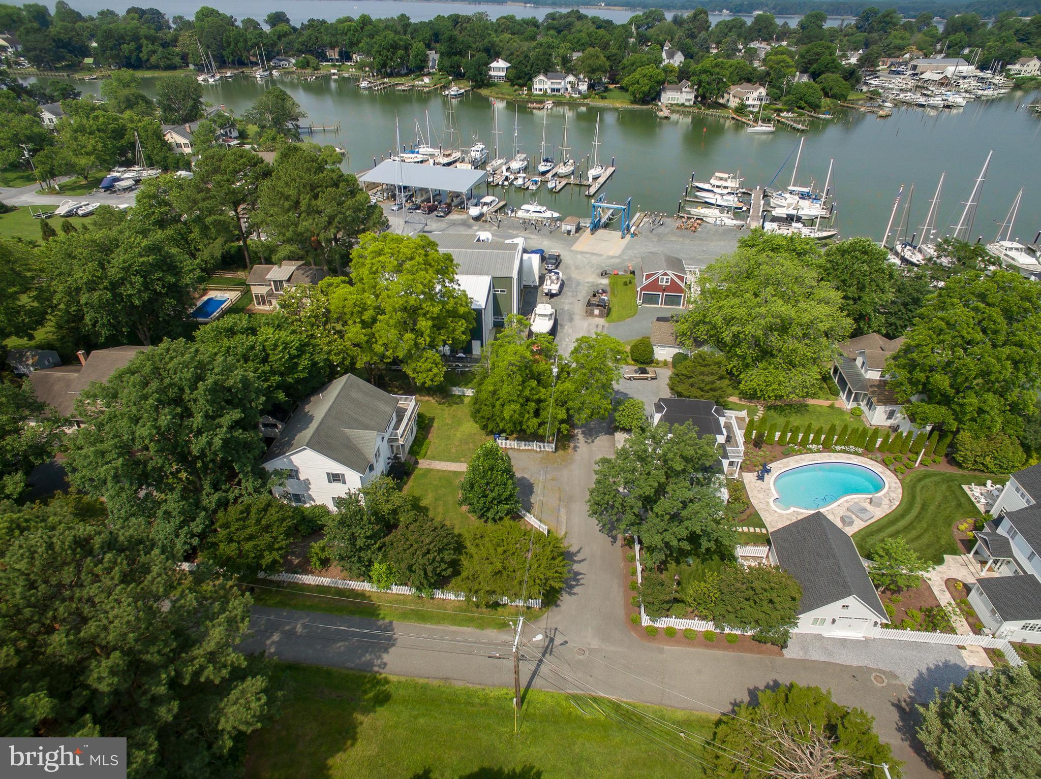 101 Sinclair Street Oxford, MD 21654 - Photo 5 of 31 an aerial view of a house with a yard and lake view