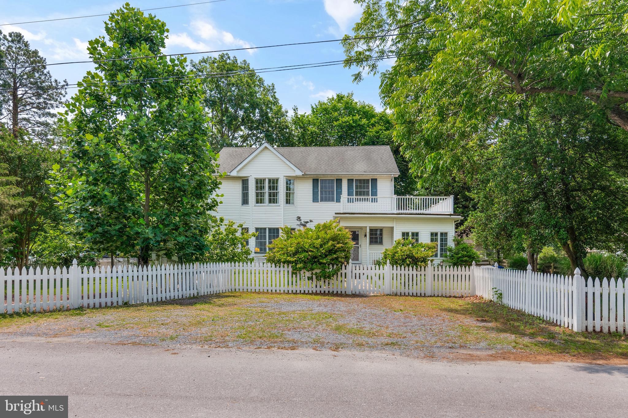 101 Sinclair Street Oxford, MD 21654 - Photo 7 of 31 a house with a tree in front of it