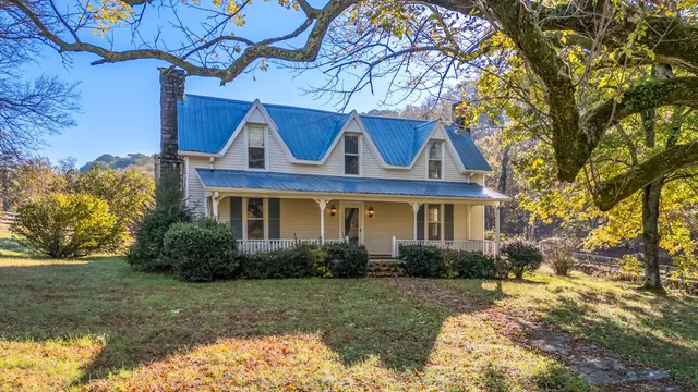 a front view of house with yard and green space