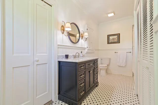 a living room with furniture a rug and a fireplace