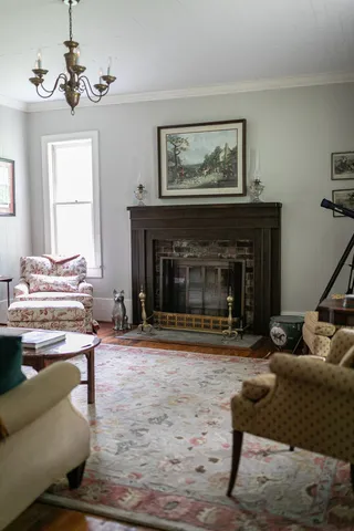 a living room with furniture and a fireplace