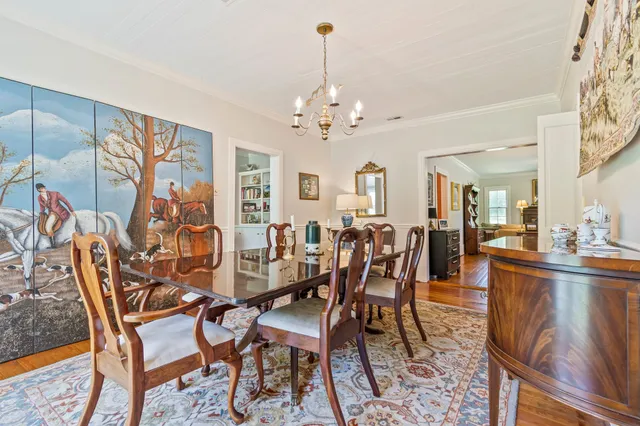 a kitchen with kitchen island granite countertop a sink cabinets and stainless steel appliances