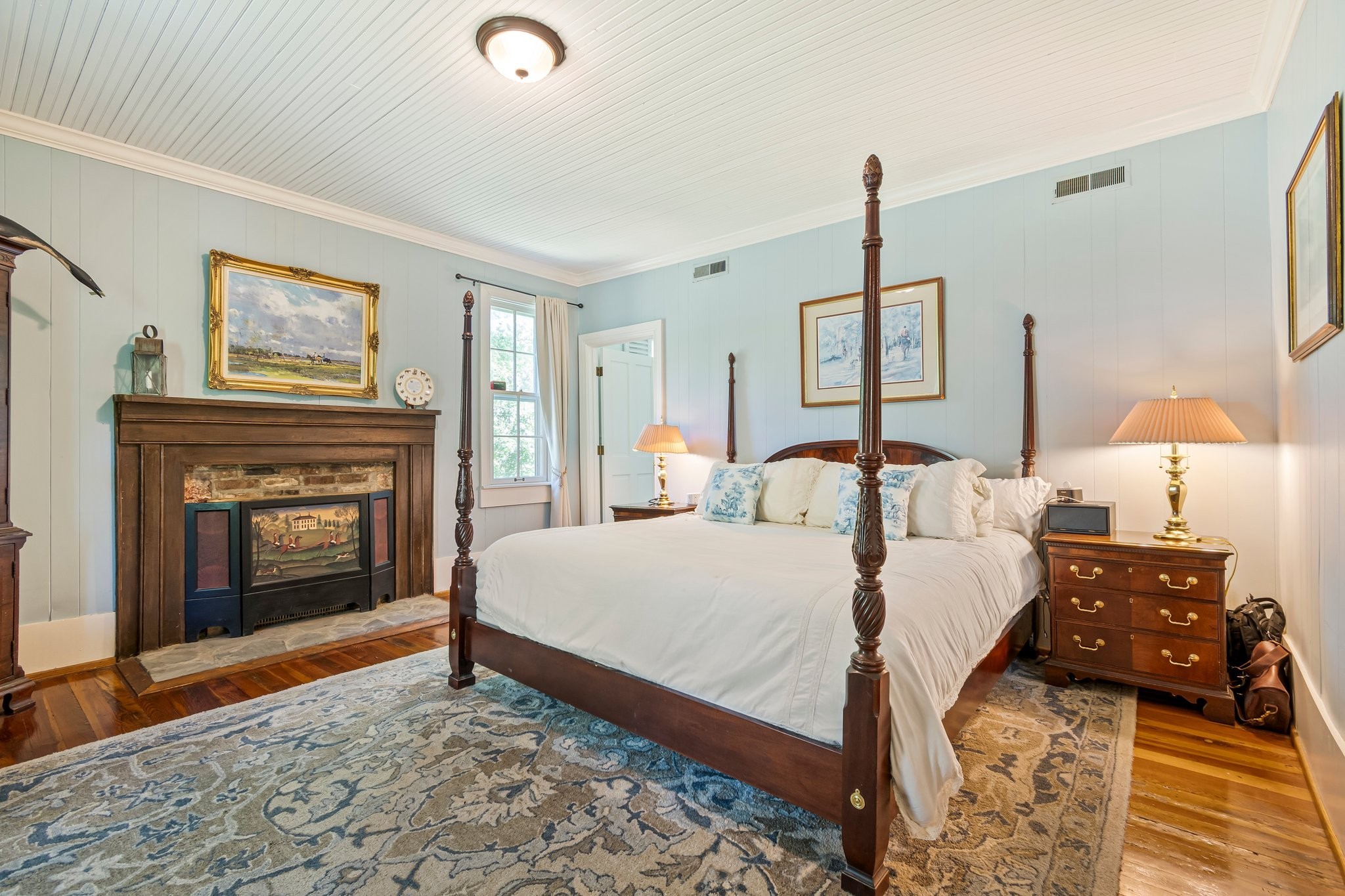 4923 Blue Creek Road Lynnville, TN 38472 - Photo 9 of 69 a bedroom with a bed and a fireplace