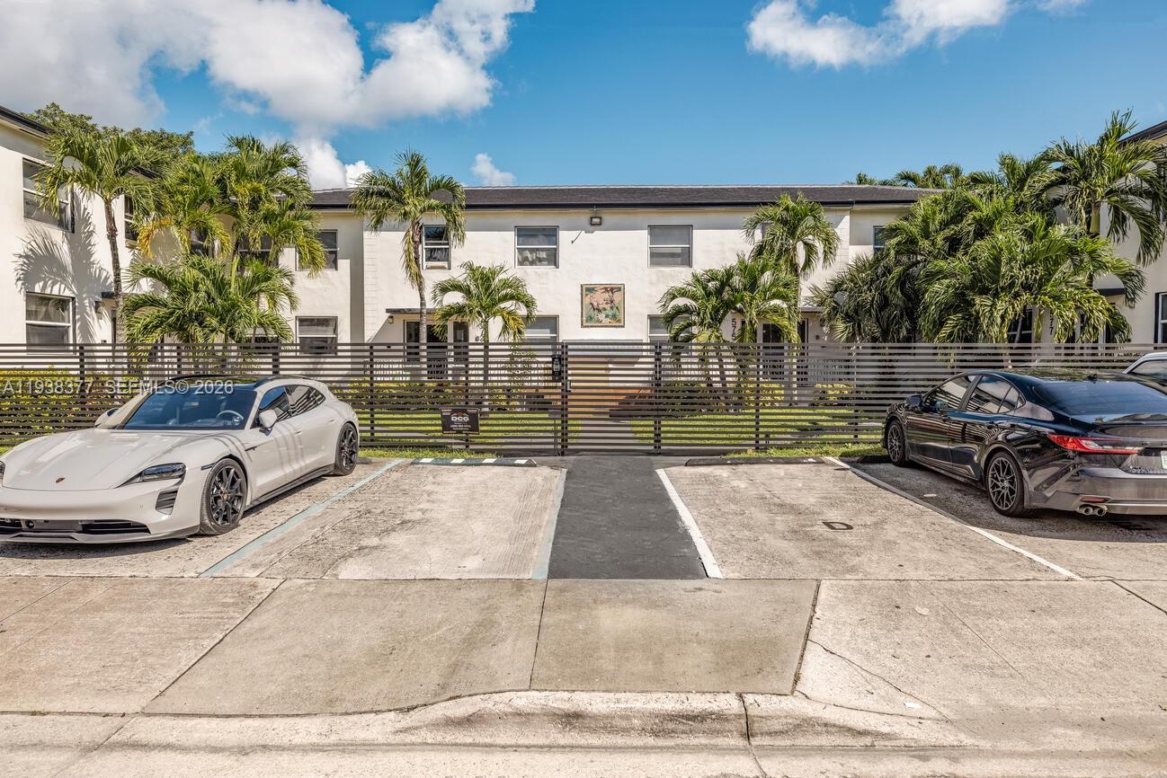 577 Northeast 82nd Street, Unit 14 Miami, FL 33138 - Photo 1 of 11 a view of street with parked cars