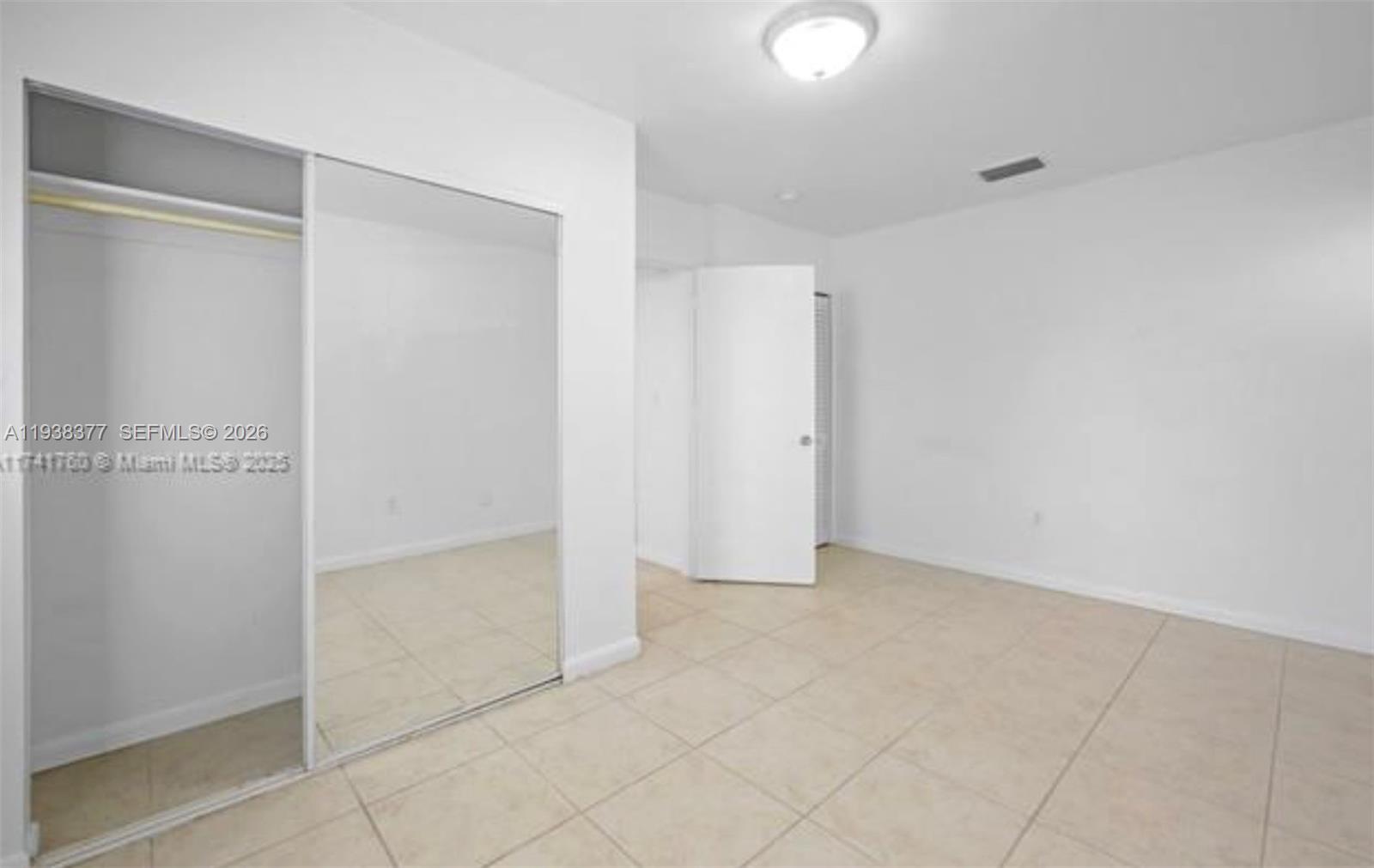 577 Northeast 82nd Street, Unit 14 Miami, FL 33138 - Photo 9 of 11 a view of an empty room