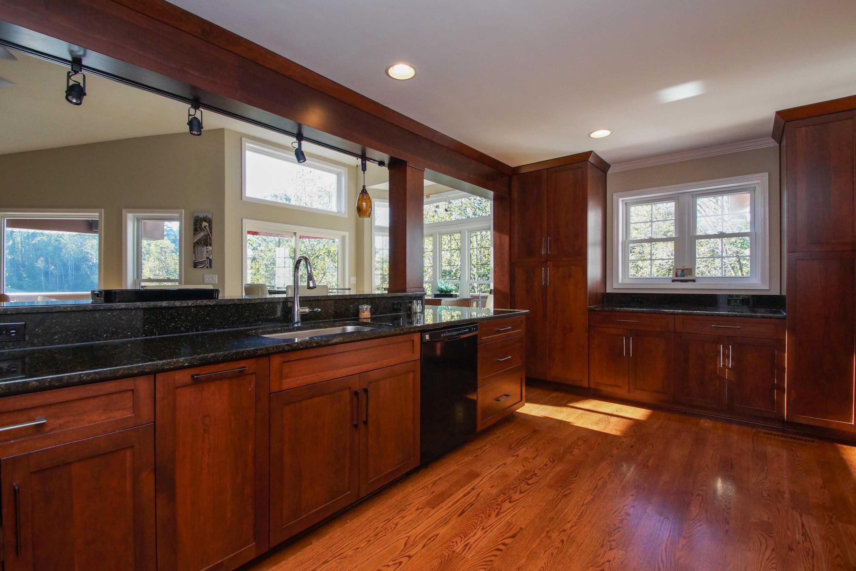 2086 Trails End Road Goodview, VA 24095 - Photo 11 of 47 a large kitchen with kitchen island granite countertop a large window a sink and stainless steel appliances