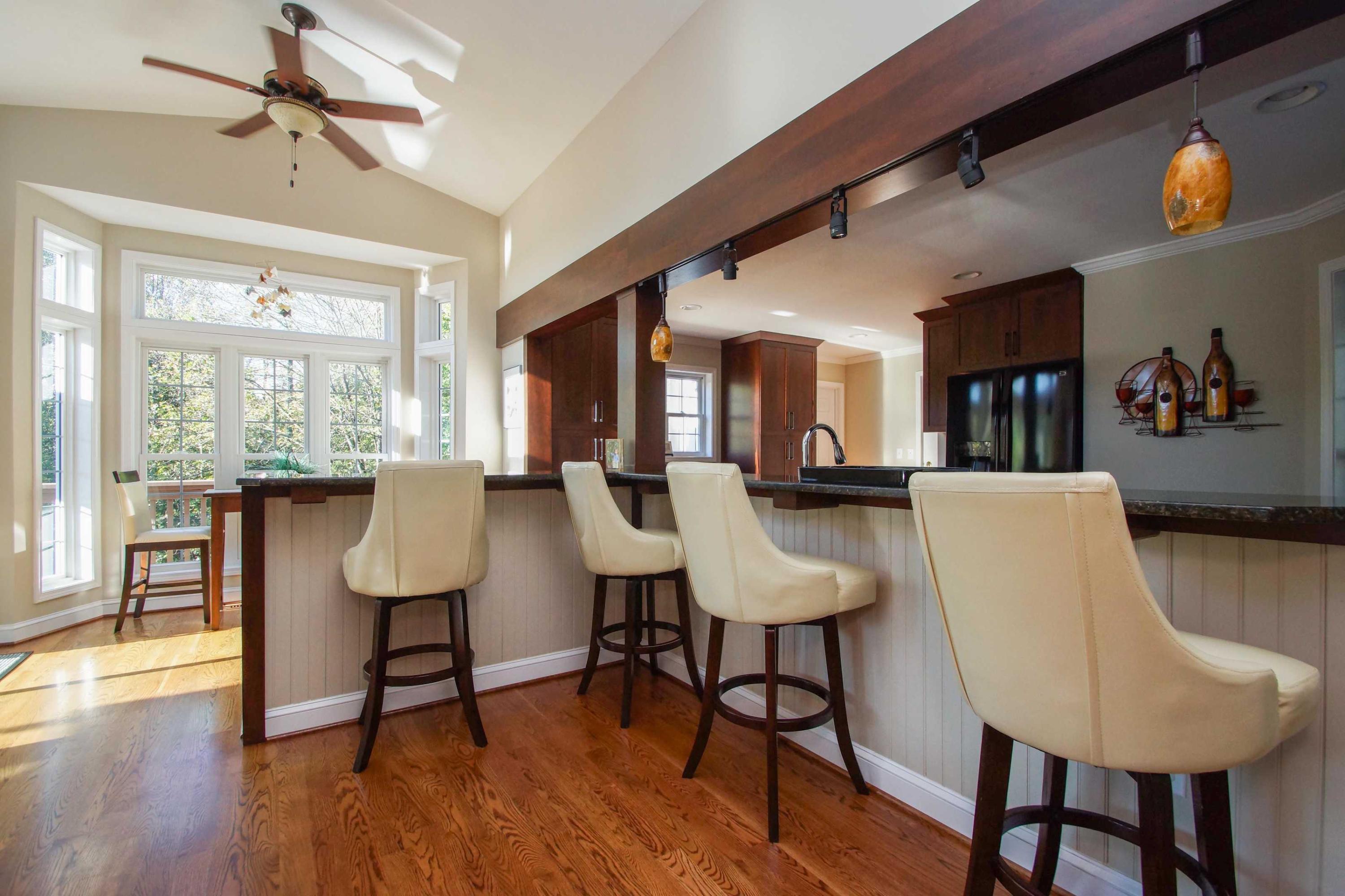 2086 Trails End Road Goodview, VA 24095 - Photo 13 of 47 a view of a dining room with furniture window and wooden floor