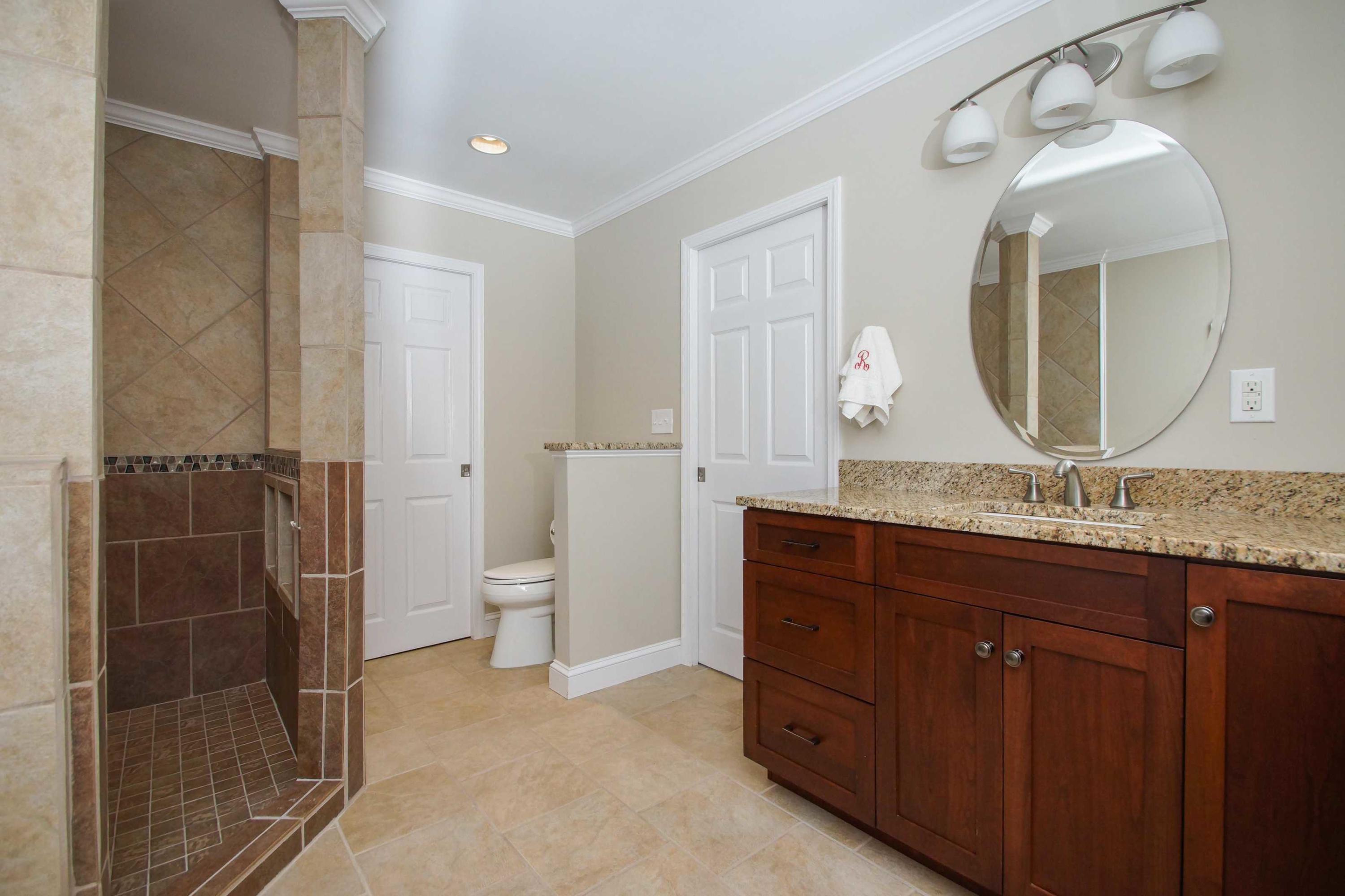 2086 Trails End Road Goodview, VA 24095 - Photo 20 of 47 a bathroom with a granite countertop sink a toilet and a mirror