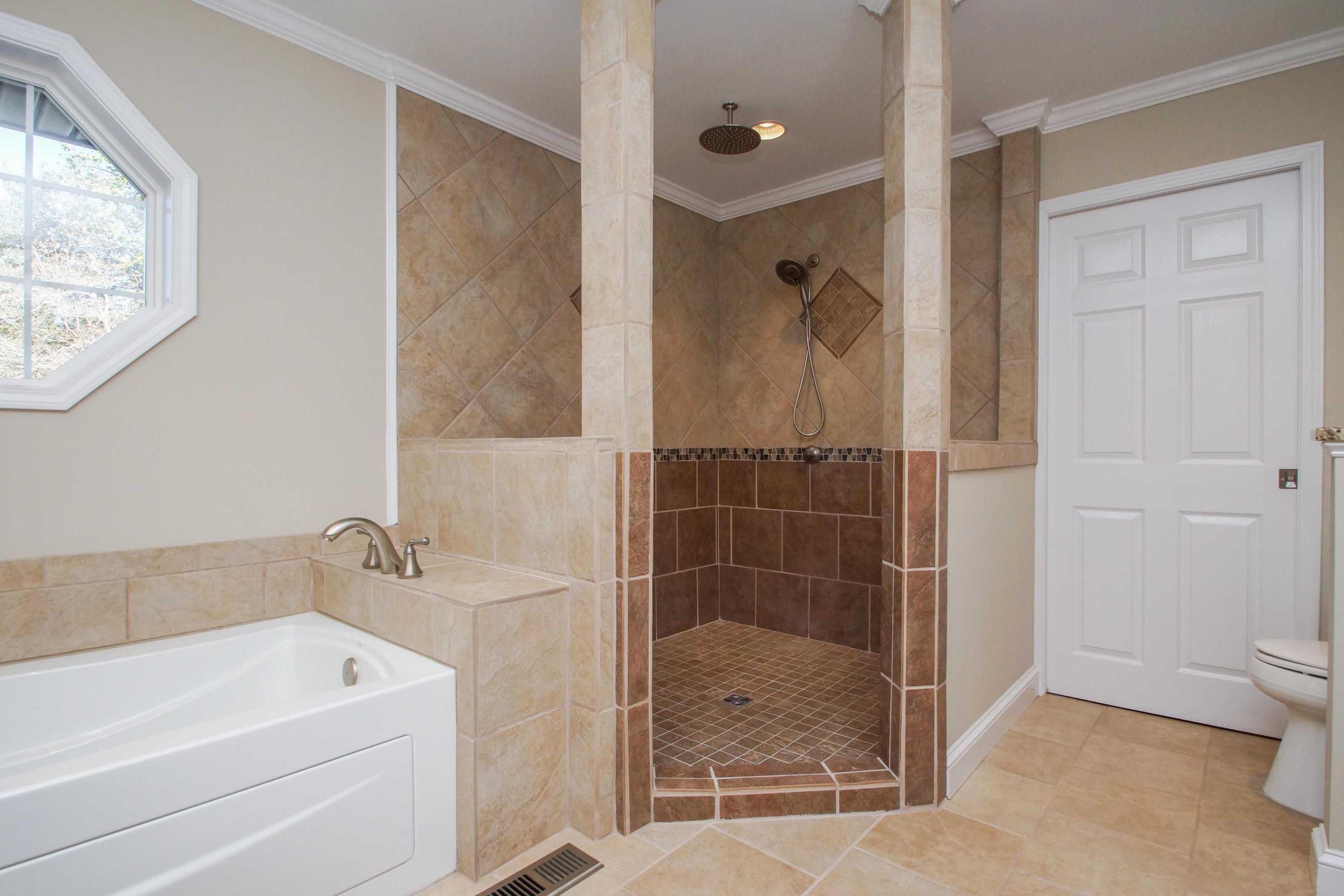 2086 Trails End Road Goodview, VA 24095 - Photo 21 of 47 a bathroom with a tub a toilet and a shower