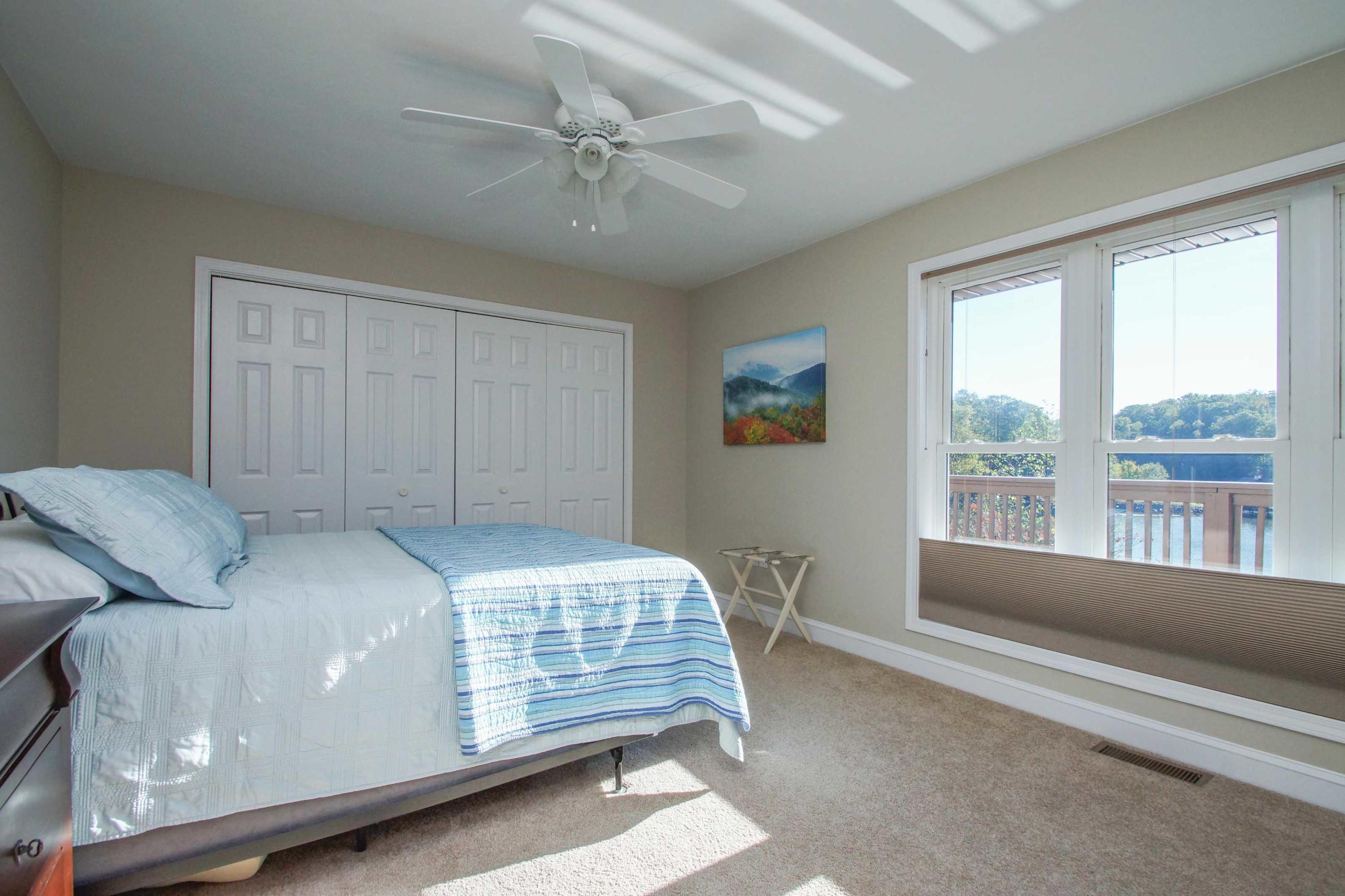 2086 Trails End Road Goodview, VA 24095 - Photo 23 of 47 a bedroom with a large bed and a large window