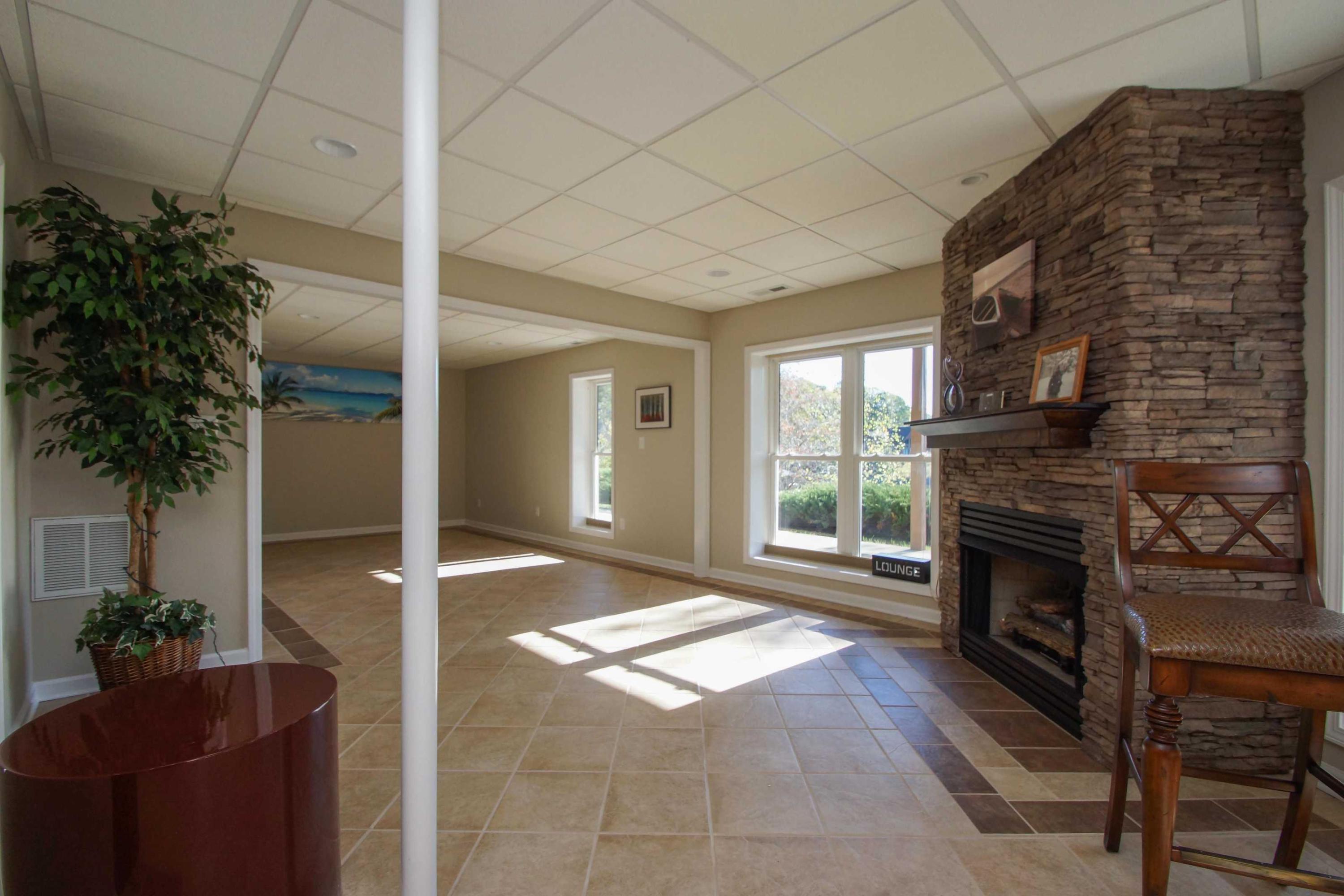 2086 Trails End Road Goodview, VA 24095 - Photo 31 of 47 a living room with furniture windows and a fireplace