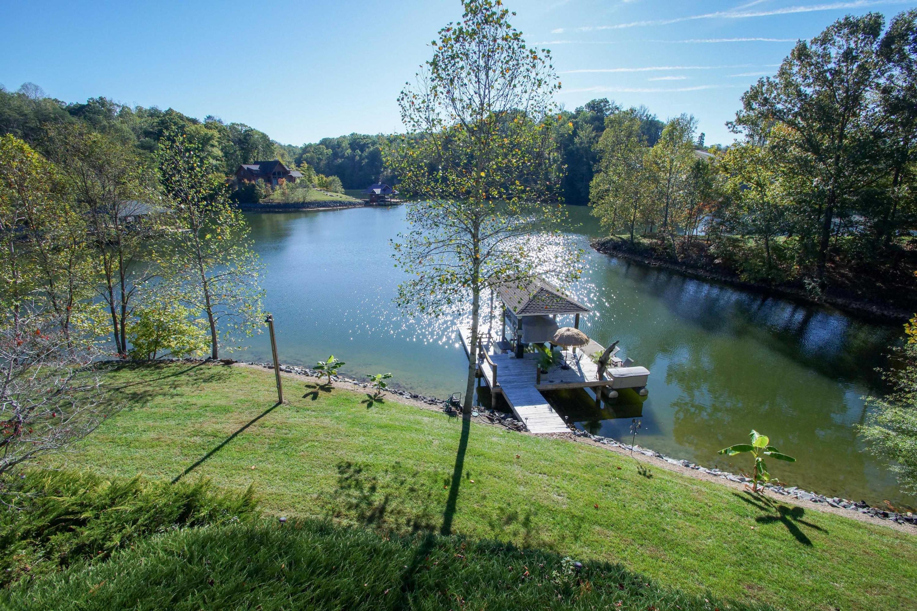 2086 Trails End Road Goodview, VA 24095 - Photo 38 of 47 a backyard of a house with table and chairs