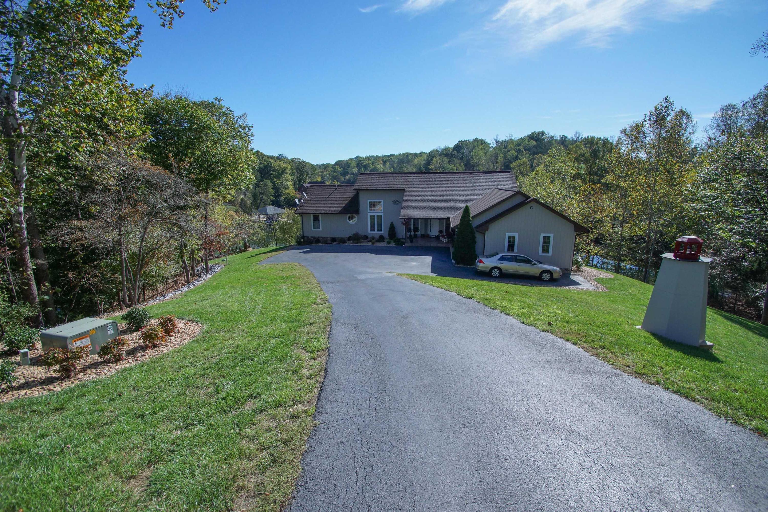 2086 Trails End Road Goodview, VA 24095 - Photo 5 of 47 a front view of a house with garden