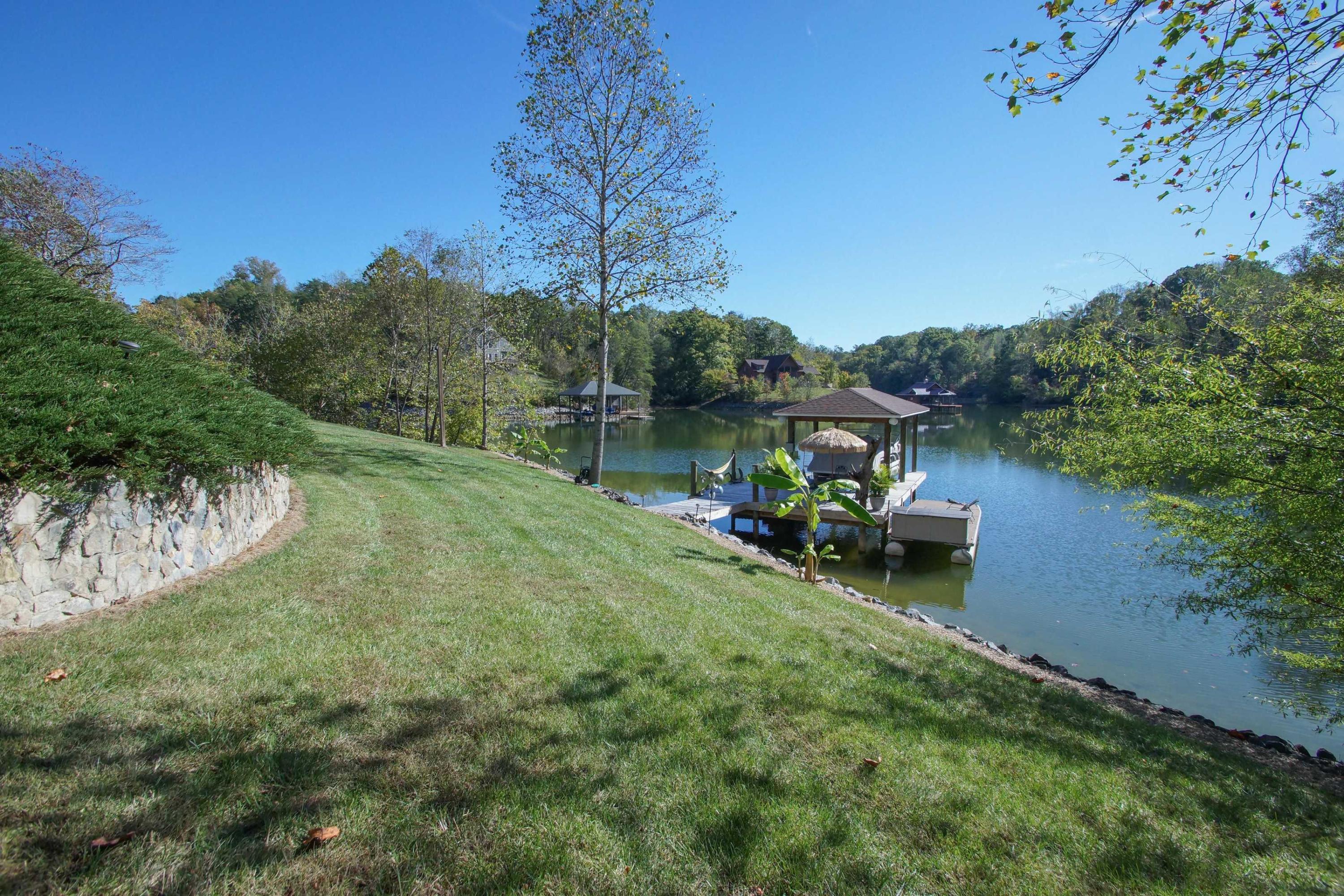 2086 Trails End Road Goodview, VA 24095 - Photo 41 of 47 a backyard of a house with table and chairs