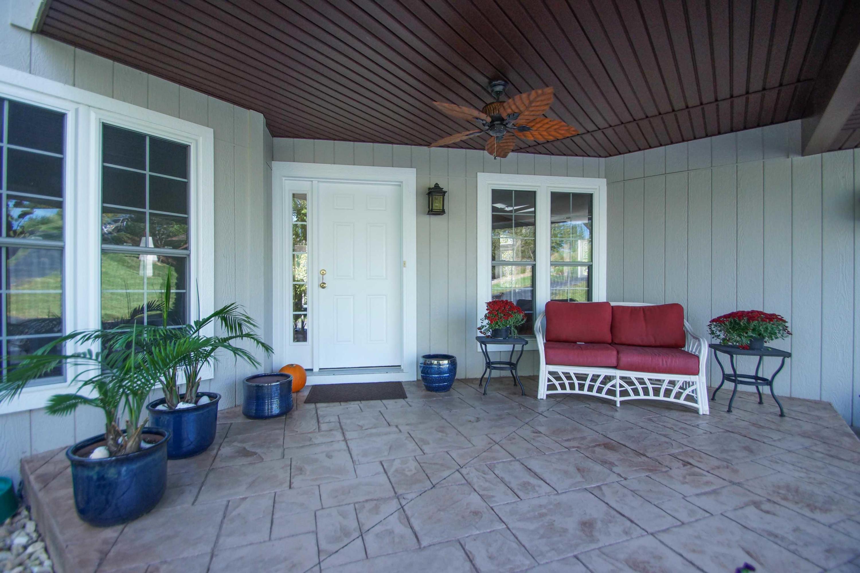 2086 Trails End Road Goodview, VA 24095 - Photo 7 of 47 a view of a patio with chairs and potted plants