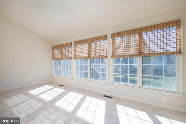 a view of empty room with windows