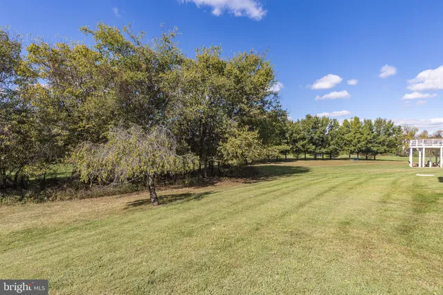 a swimming pool with wooden fence
