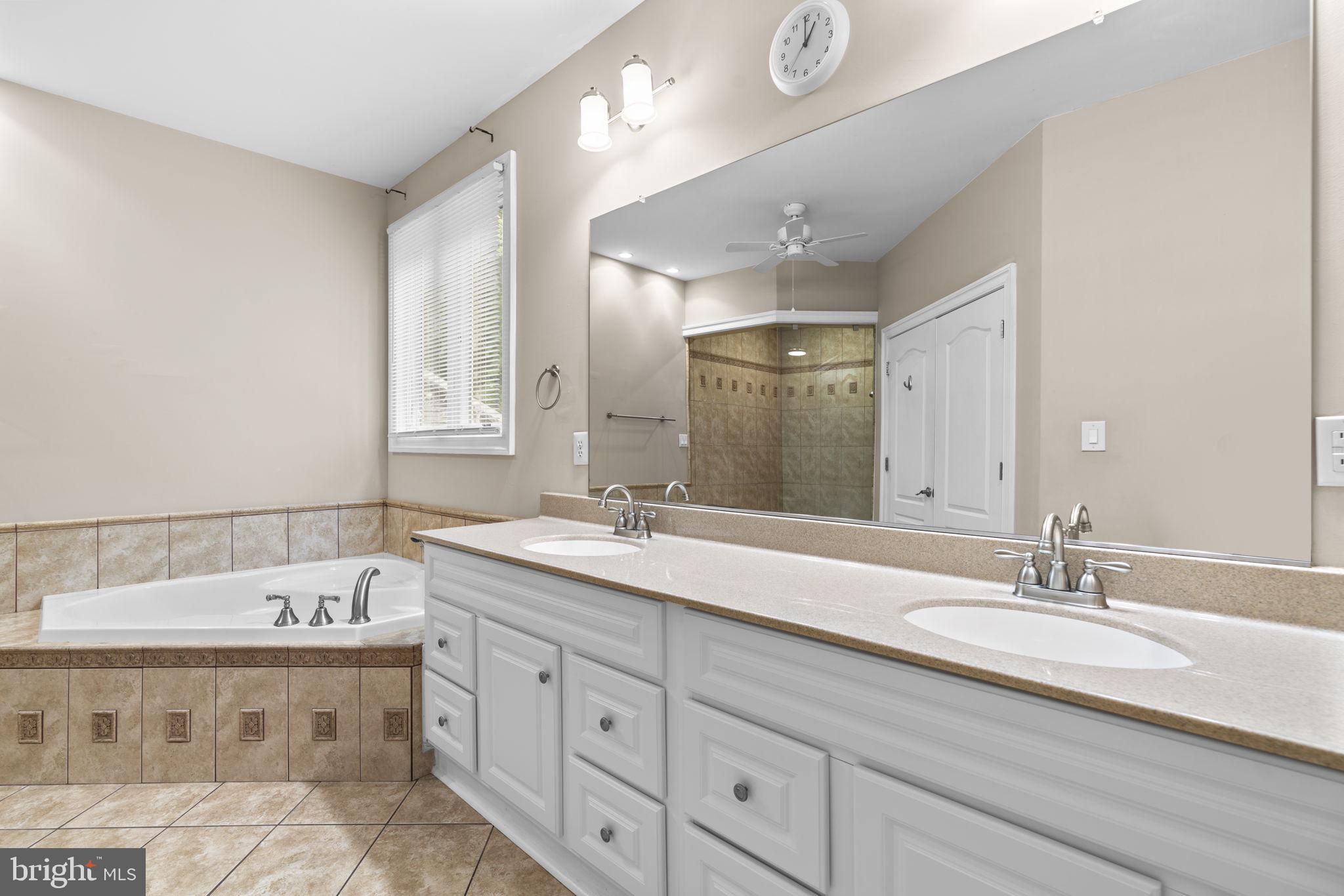 8024 Solley Road Glen Burnie, MD 21060 - Photo 37 of 83 a spacious bathroom with a double vanity sink mirror and double