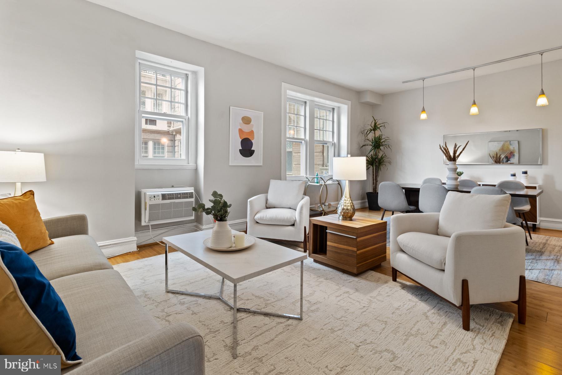 3420 16th Street Northwest, Unit 101 Washington, DC 20010 - Photo 11 of 29 a living room with furniture and wooden floor