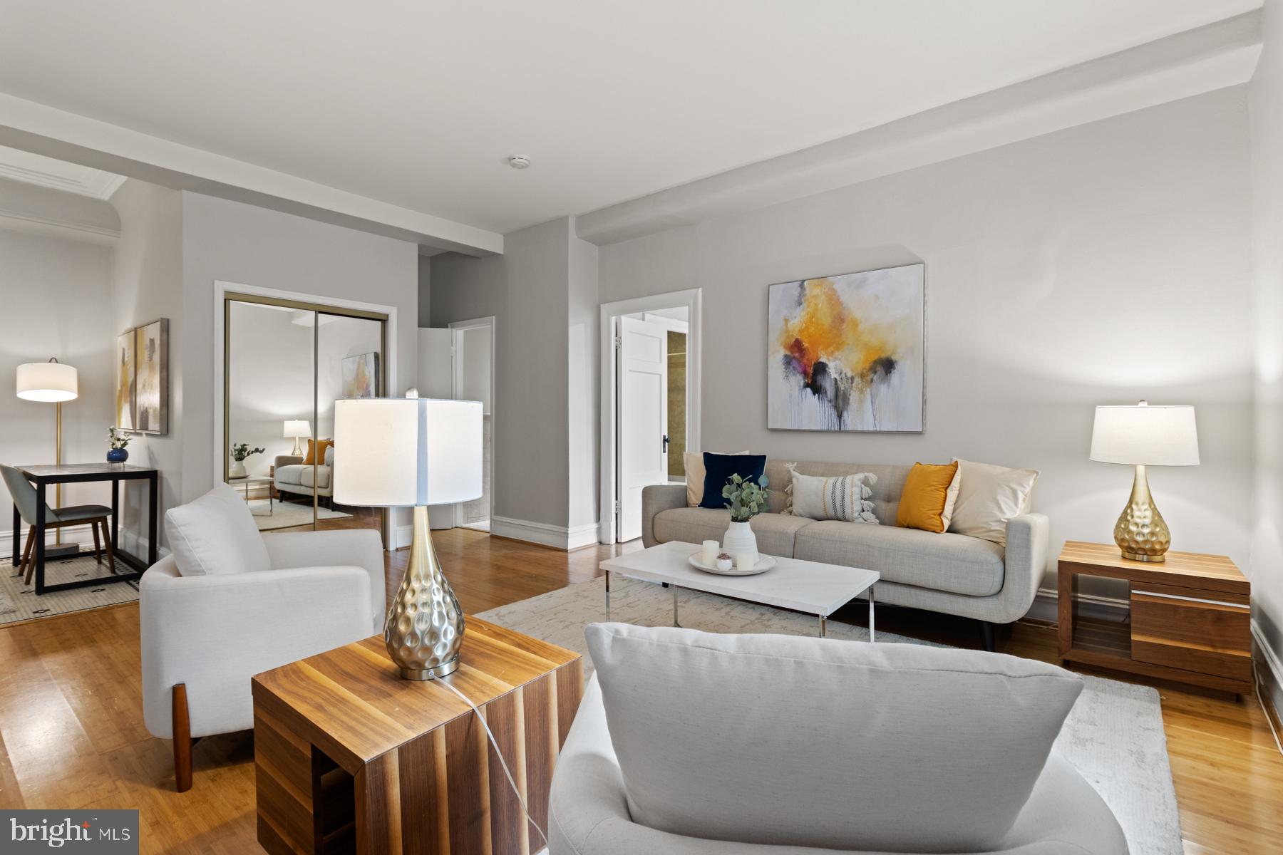 3420 16th Street Northwest, Unit 101 Washington, DC 20010 - Photo 12 of 29 a living room with furniture and a lamp