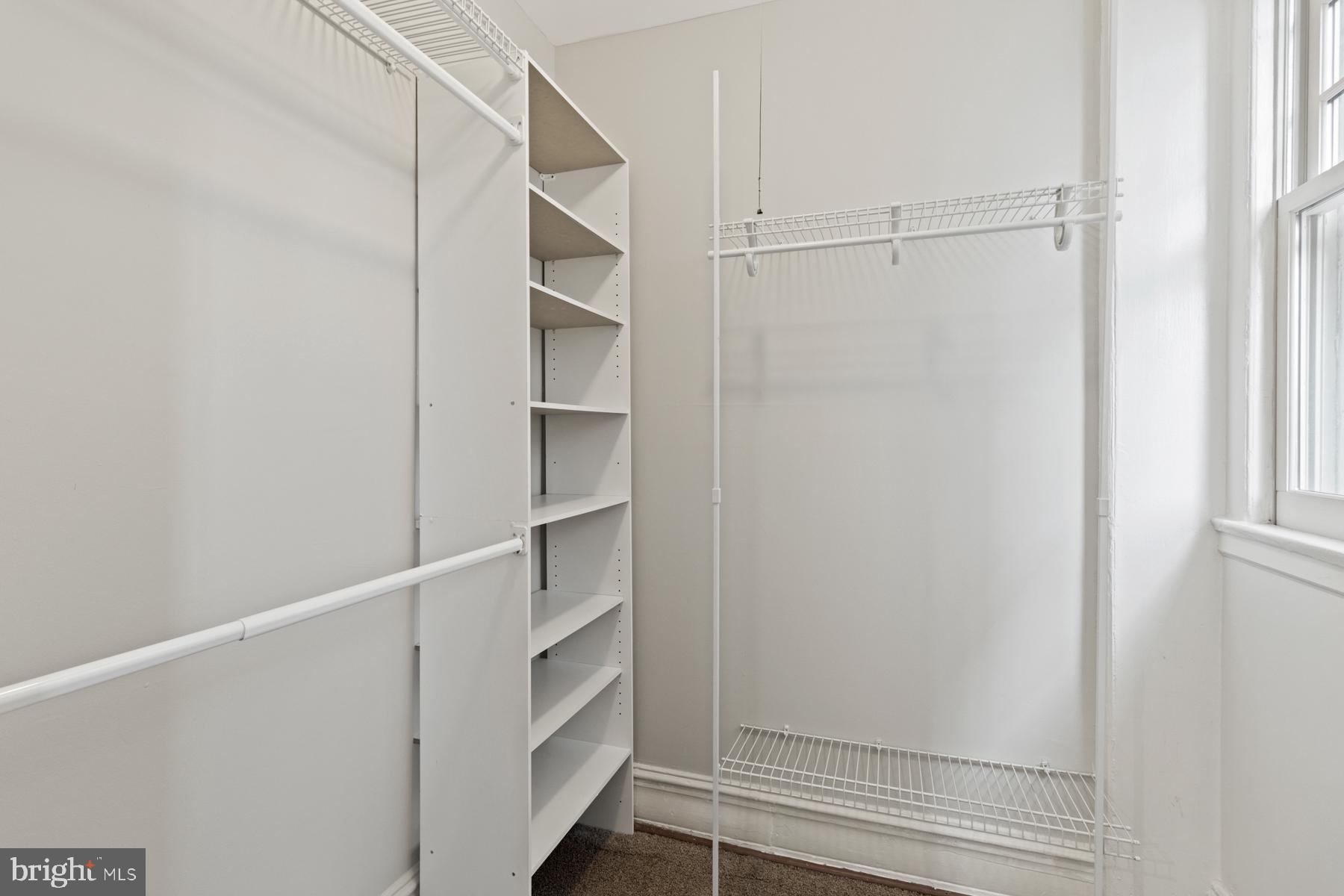 3420 16th Street Northwest, Unit 101 Washington, DC 20010 - Photo 21 of 29 a view of walk in closet with empty racks
