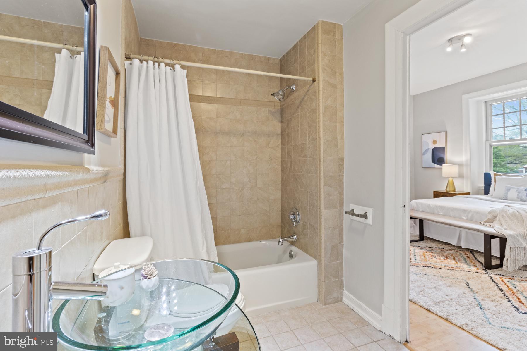 3420 16th Street Northwest, Unit 101 Washington, DC 20010 - Photo 24 of 29 a bathroom with a sink toilet and shower