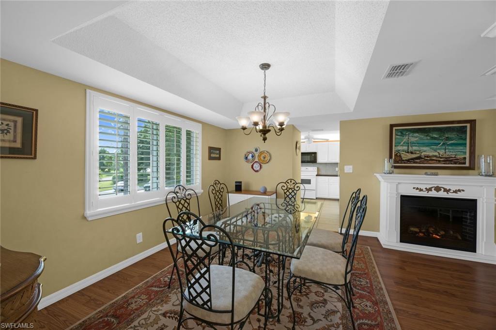 237 Albi Road, Unit 4 Naples, FL 34112 - Photo 15 of 50 Formal dining with electric fireplace