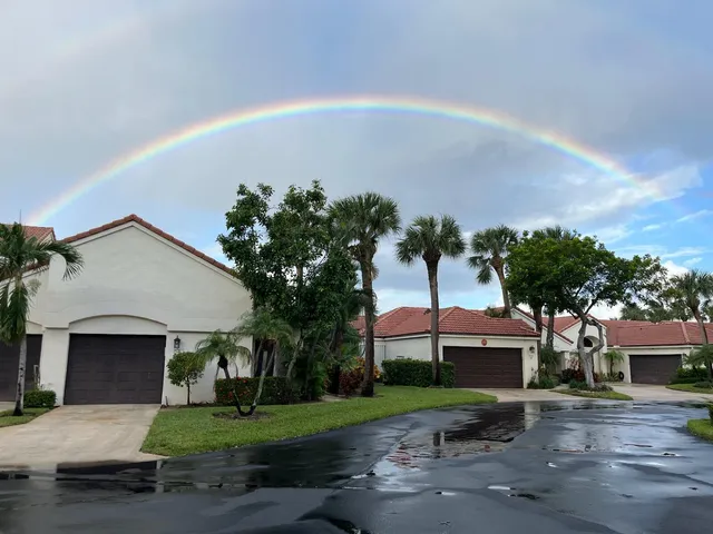 a view of house with outdoor space and trees