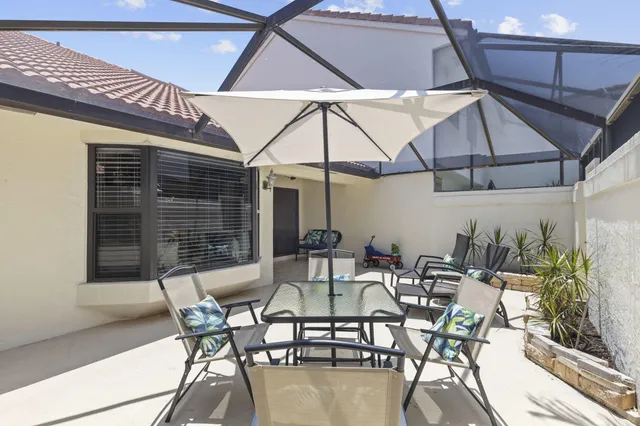 a bedroom with a bed and a lamp