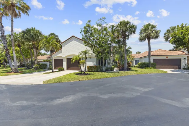a bedroom with a bed and lamp
