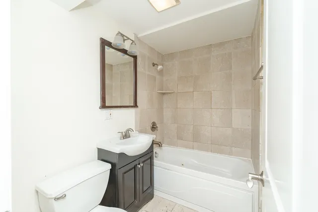 a bathroom with a sink toilet and bathtub