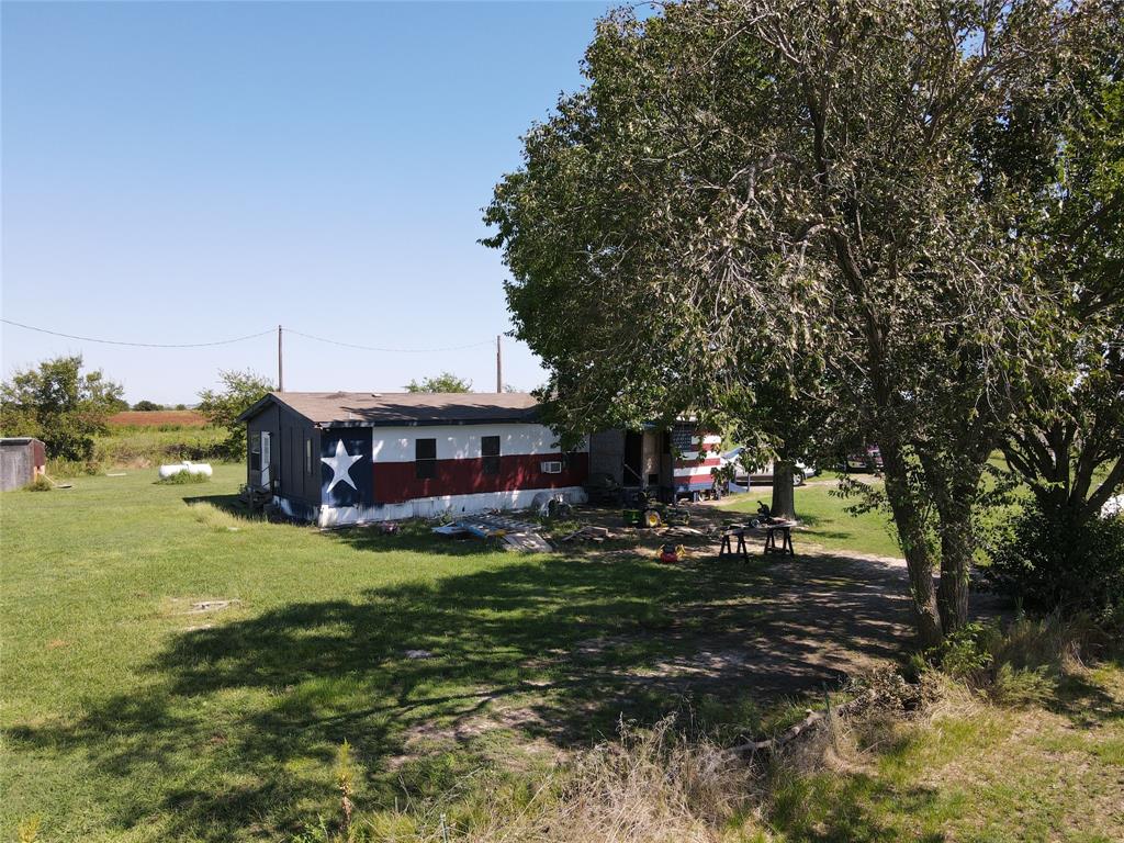 16531 Farm To Market 455 Pilot Point, TX 76258 - Photo 34 of 37 a view of a house with a yard and sitting area