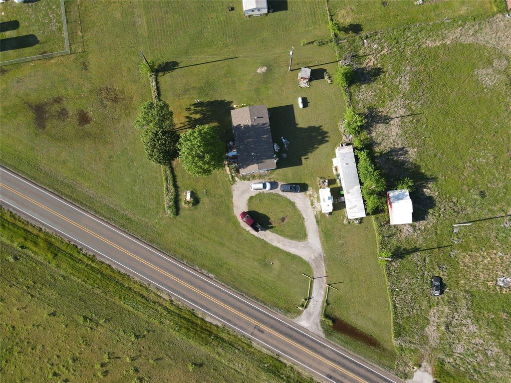 16531 Farm To Market 455 Pilot Point, TX 76258 - Photo 8 of 37 an aerial view of a residential houses with outdoor space
