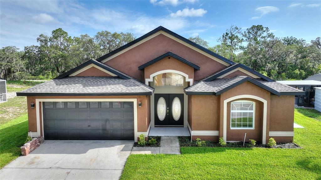 a front view of a house with garden