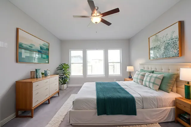 a kitchen with a sink a center island and a window