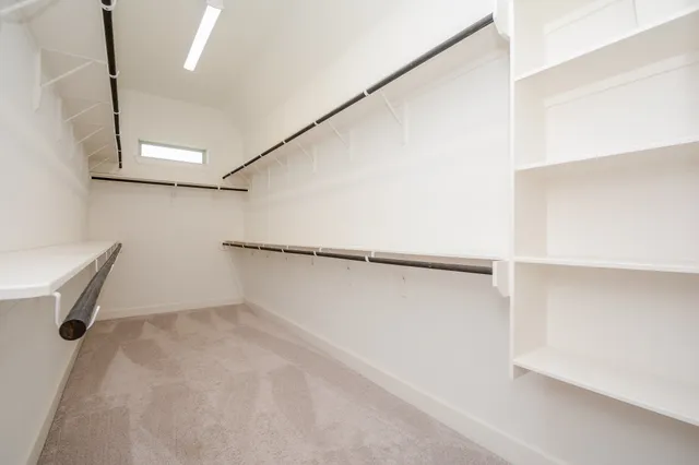 a bathroom with a sink mirror and toilet