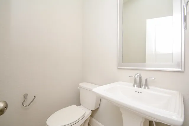 a swimming pool view with a seating space