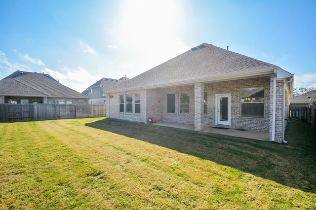 a house with garden in front of it