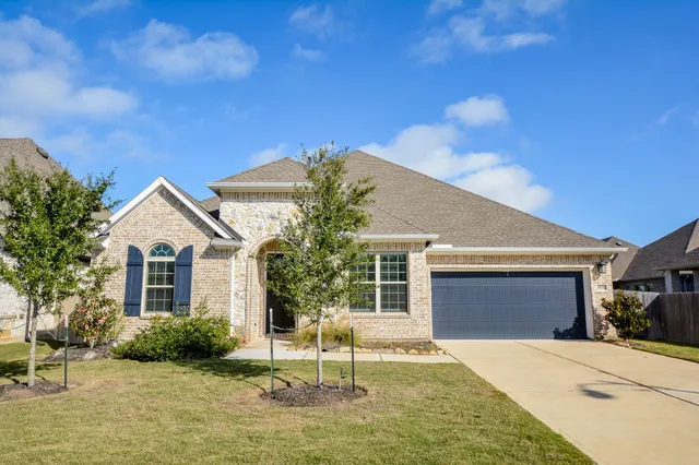 a house view with a garden space