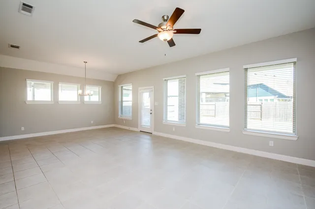 a living room with furniture or couches and a dining table with wooden floor