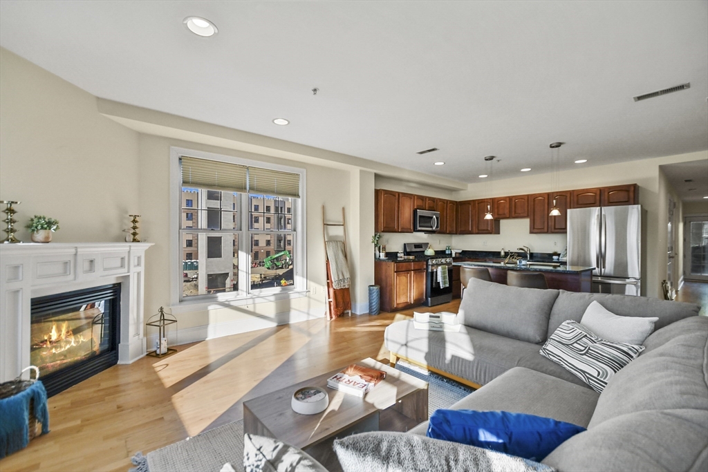 a living room with furniture and a fireplace
