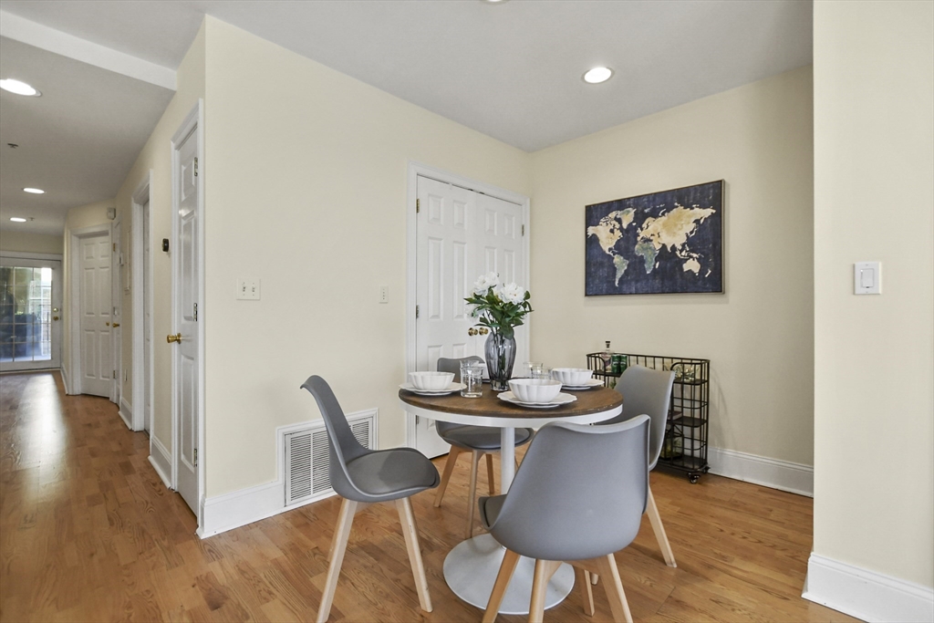 1306 Columbia Road, Unit 3E Boston, MA 02127 - Photo 16 of 40 a dining room with furniture and wooden floor