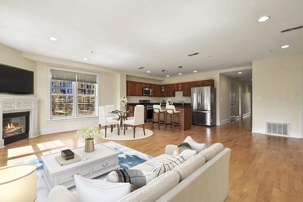 1306 Columbia Road, Unit 3E Boston, MA 02127 - Photo 21 of 40 a living room with furniture and a fireplace