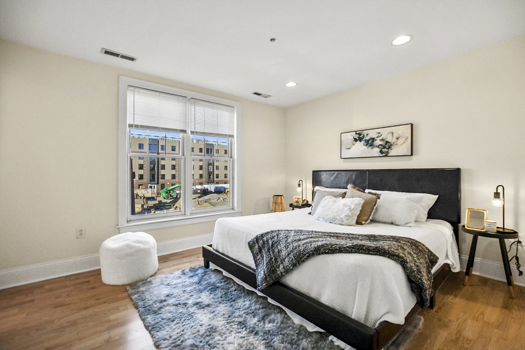 1306 Columbia Road, Unit 3E Boston, MA 02127 - Photo 24 of 40 a bedroom with a bed and a window