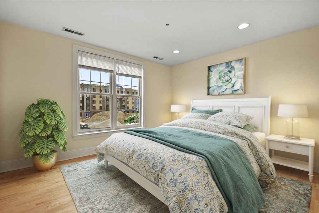 1306 Columbia Road, Unit 3E Boston, MA 02127 - Photo 28 of 40 a bedroom with a bed and a window