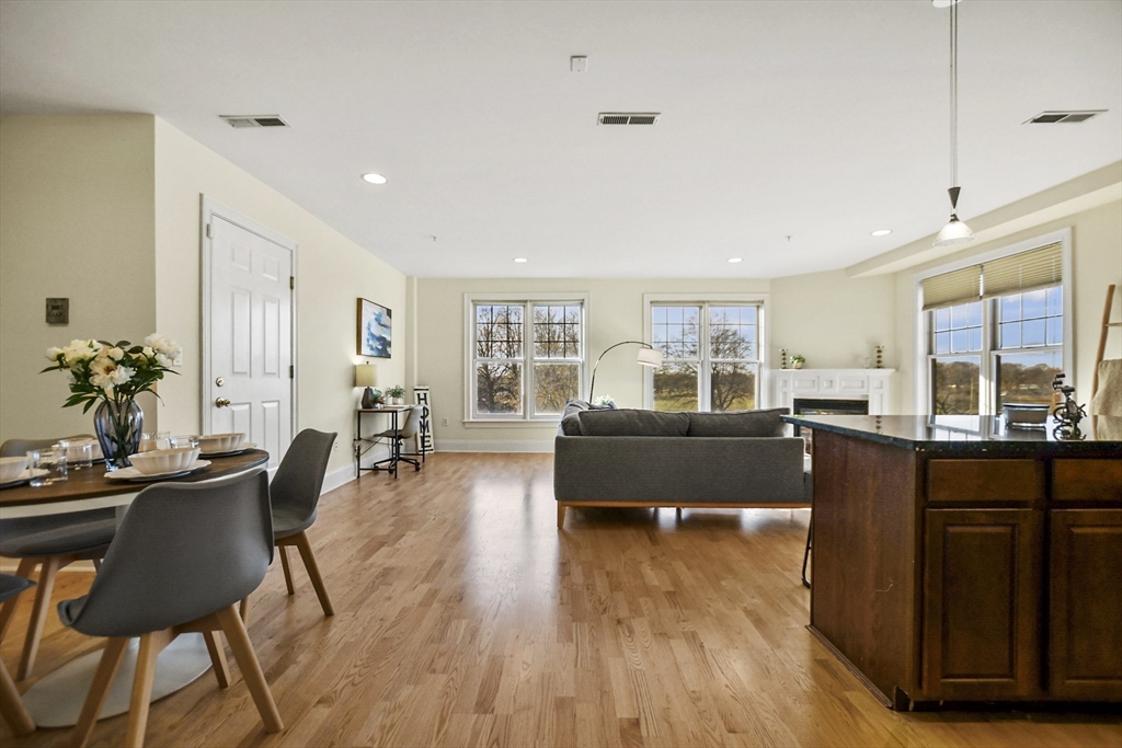 1306 Columbia Road, Unit 3E Boston, MA 02127 - Photo 3 of 40 a living room with furniture and large windows