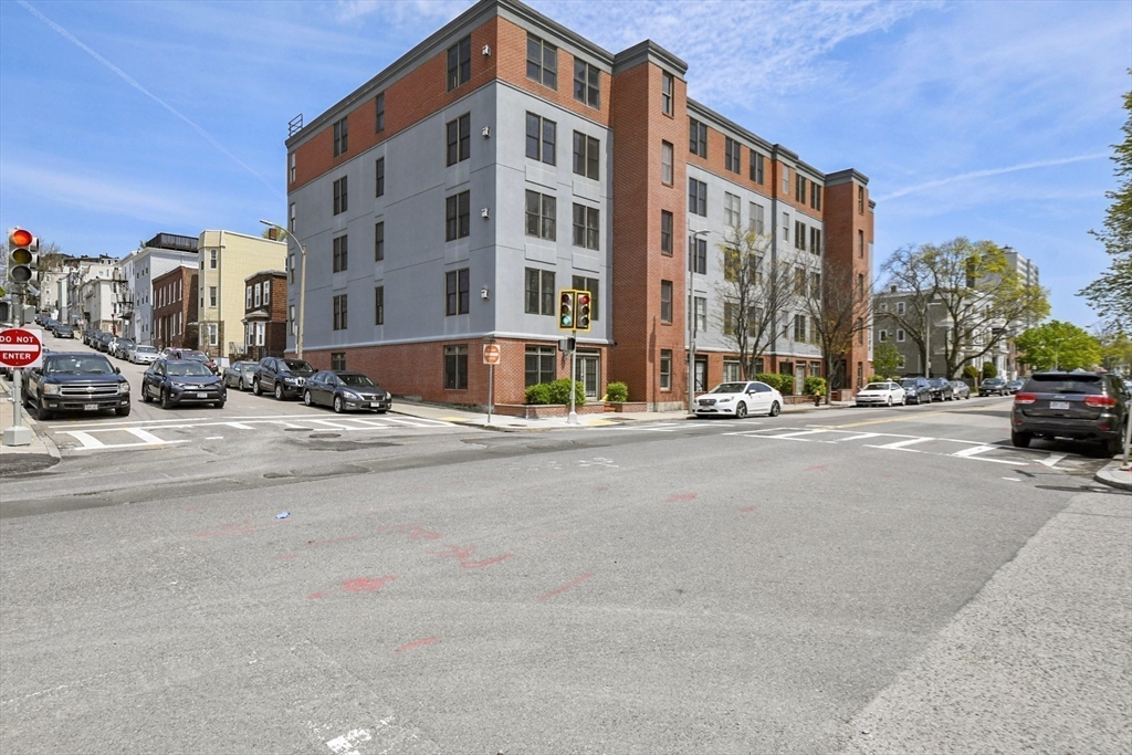 1306 Columbia Road, Unit 3E Boston, MA 02127 - Photo 35 of 40 a view of a street with a building in the background