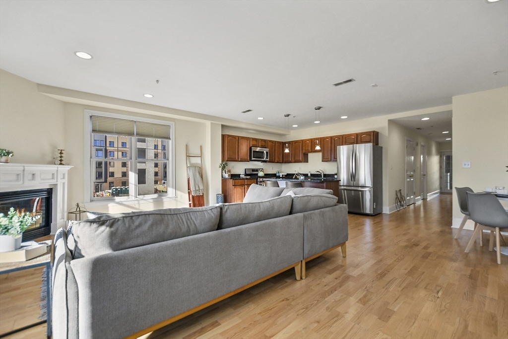 1306 Columbia Road, Unit 3E Boston, MA 02127 - Photo 8 of 40 a living room with furniture and a fireplace