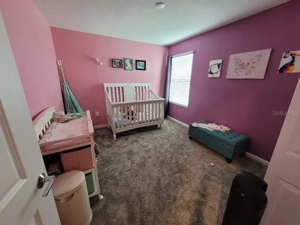 a bedroom with a bed and furniture